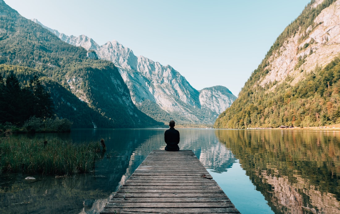 A still alpine lake framed by mountains