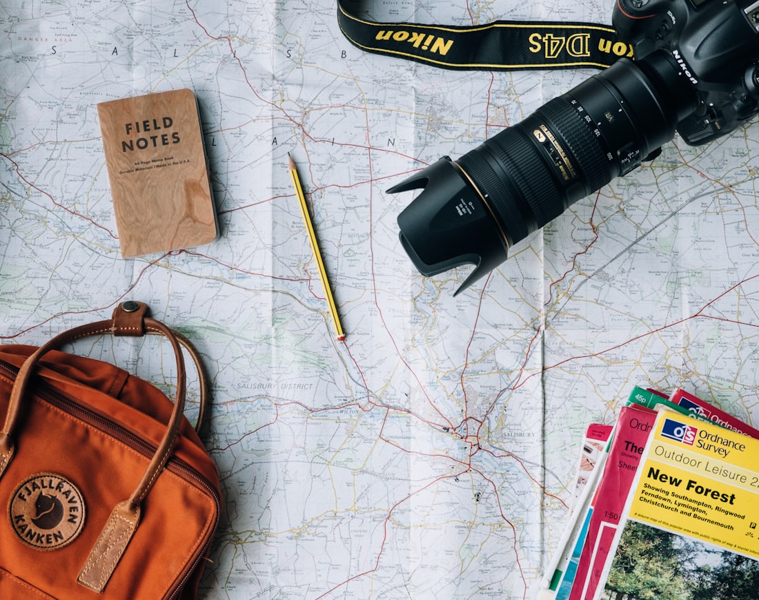 Maps, compass and kit laid out for trip planning