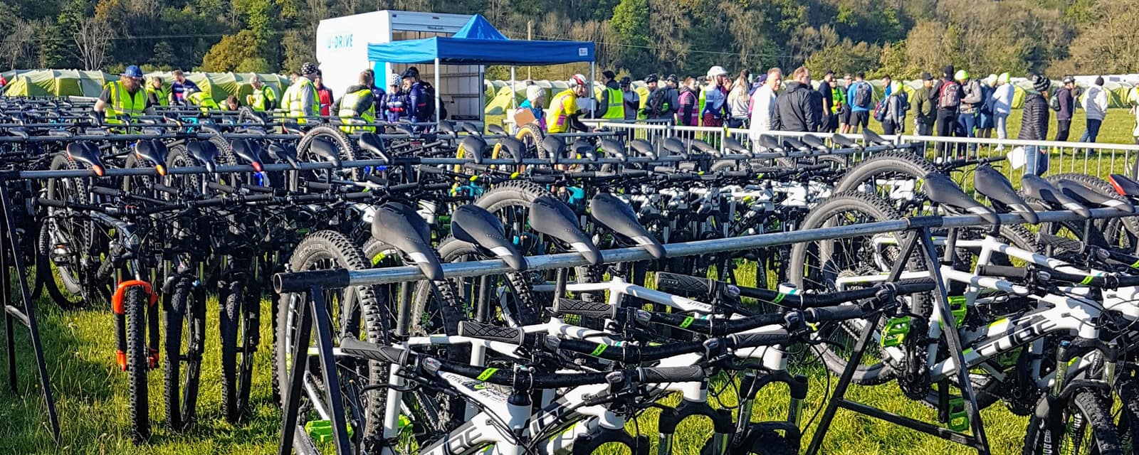 TPG's cycling support team and a field of bikes at an event