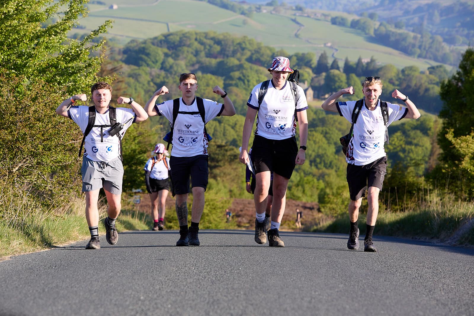 A group hiking together with mountains behind